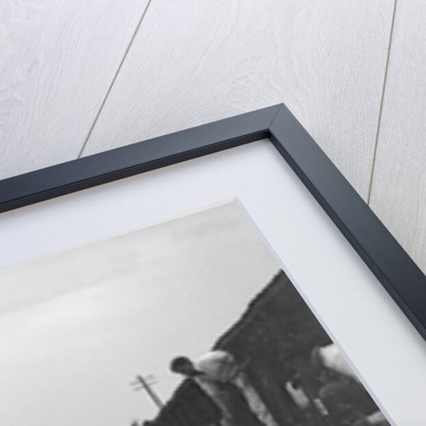 GL Baker's 5954 cc Minerva undergoing a rear wheel change at Brooklands by Bill Brunell