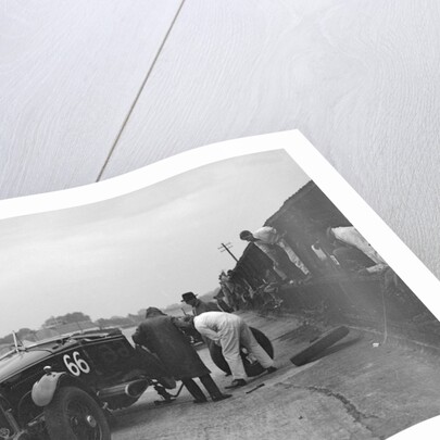 GL Baker's 5954 cc Minerva undergoing a rear wheel change at Brooklands by Bill Brunell