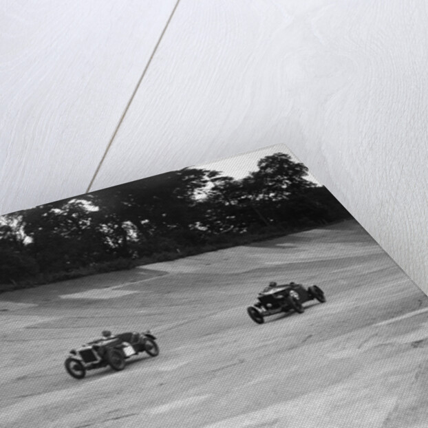 Austin Ulster leading a Windsor on the banking at Brooklands by Bill Brunell