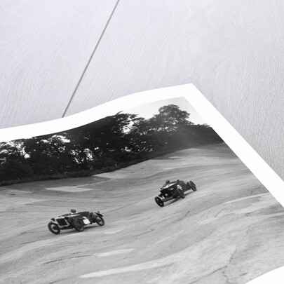 Austin Ulster leading a Windsor on the banking at Brooklands by Bill Brunell