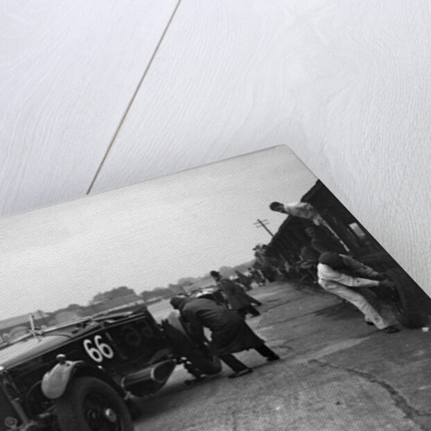 GL Baker's 5954 cc Minerva undergoing a rear wheel change at Brooklands by Bill Brunell