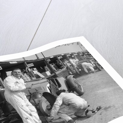 Mechanic working on a Talbot 105 at the JCC Double Twelve race, Brooklands, 8/9 May 1931 by Bill Brunell
