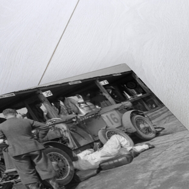 Mechanic working on a Lea Francis J type at the JCC Double Twelve race, Brooklands, May 1931 by Bill Brunell