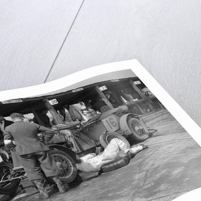 Mechanic working on a Lea Francis J type at the JCC Double Twelve race, Brooklands, May 1931 by Bill Brunell