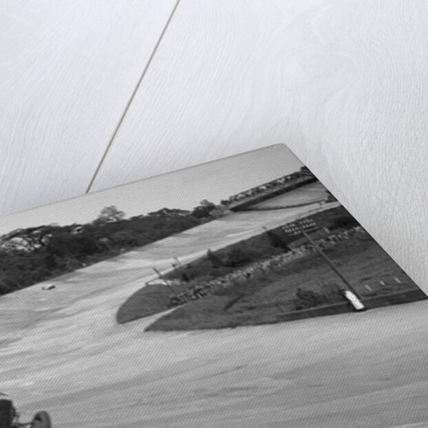 Eddie Hall's Bentley leading a Bugatti on the banking at Brooklands. by Bill Brunell