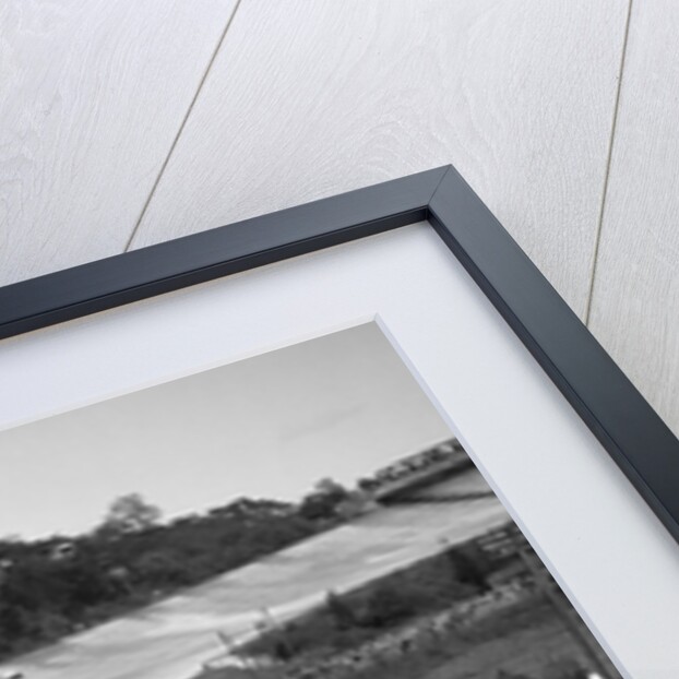 Eddie Hall's Bentley leading a Bugatti on the banking at Brooklands. by Bill Brunell