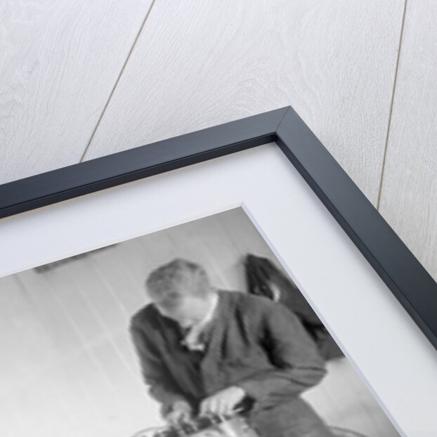 Mechanics working on Raymond Mays' 4500 cc Invicta car by Bill Brunell