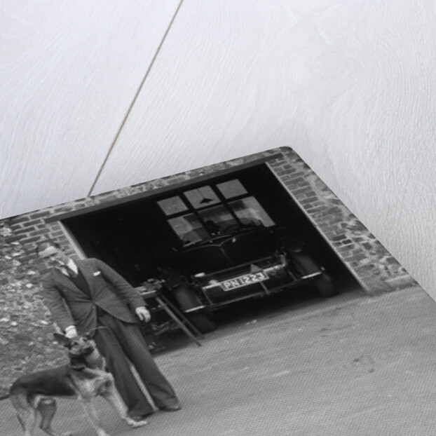 Geoffrey Baker standing in front of a Minerva 5954 cc car by Bill Brunell