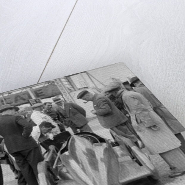 People examining Leon Cushman's Austin 7 racer at Brooklands for a speed record attempt, 1931 by Bill Brunell