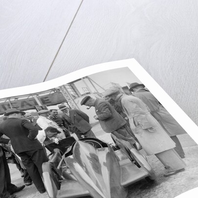 People examining Leon Cushman's Austin 7 racer at Brooklands for a speed record attempt, 1931 by Bill Brunell