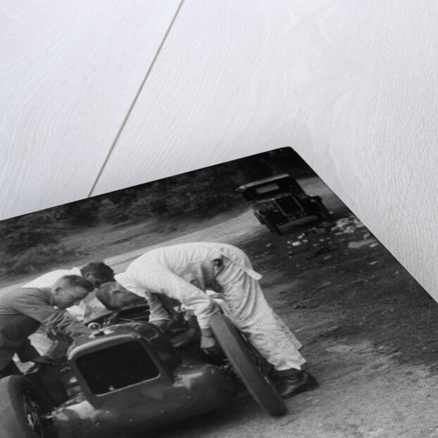 Mechanics working on Leon Cushman's Austin 7 racer for a speed record attempt, Brooklands, 1931 by Bill Brunell
