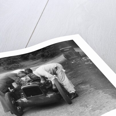 Mechanics working on Leon Cushman's Austin 7 racer for a speed record attempt, Brooklands, 1931 by Bill Brunell