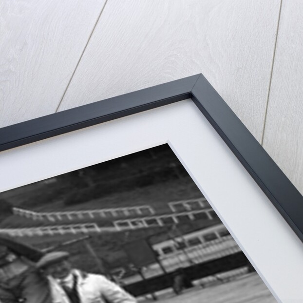 Leon Cushman being carried aloft after making a successful speed record attempt, Brooklands, 1931 by Bill Brunell