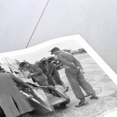 People examining Leon Cushman's Austin 7 racer at Brooklands for a speed record attempt, 1931 by Bill Brunell