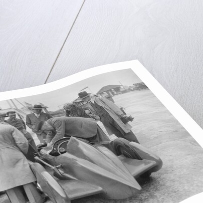 People examining Leon Cushman's Austin 7 racer at Brooklands for a speed record attempt, 1931 by Bill Brunell