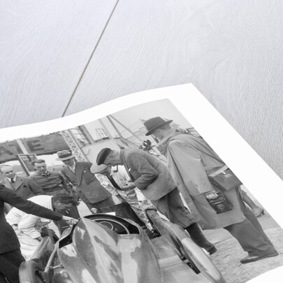 People examining Leon Cushman's Austin 7 racer at Brooklands for a speed record attempt, 1931 by Bill Brunell