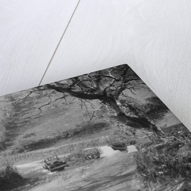 Kitty Brunell driving a 1930 Ford Model A 2-seater through a ford, 1931 by Bill Brunell