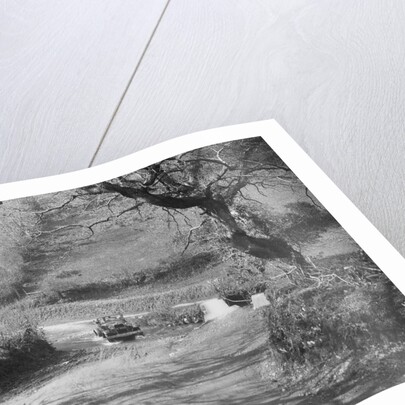 Kitty Brunell driving a 1930 Ford Model A 2-seater through a ford, 1931 by Bill Brunell