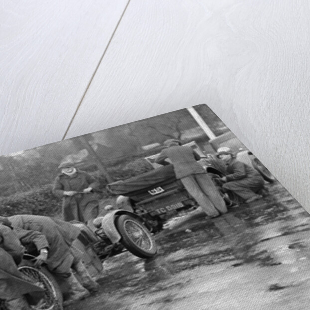 Attaching snow chains to JE Lancaster's Riley Brooklands during the Inter-Varsity Trial, 1930 by Bill Brunell