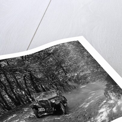 Morris Minor competing in the B&HMC Brighton-Beer Trial, Fingle Bridge Hill, Devon, 1934 by Bill Brunell