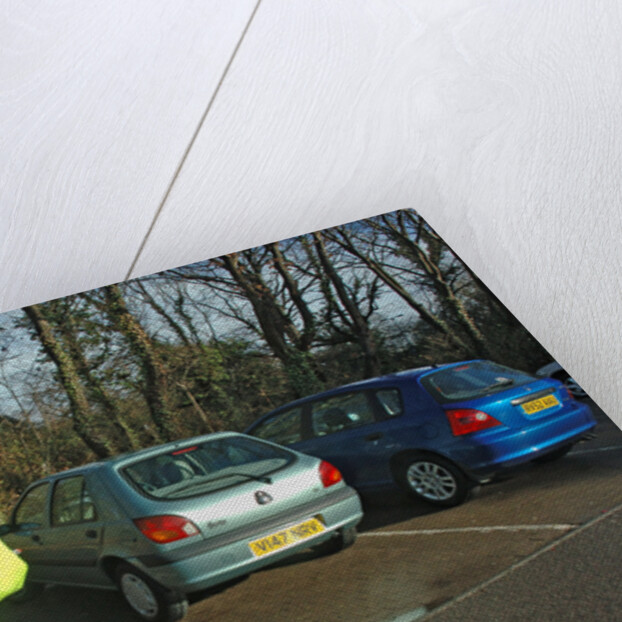 Car Park attendant recording car registration numbers by Unknown