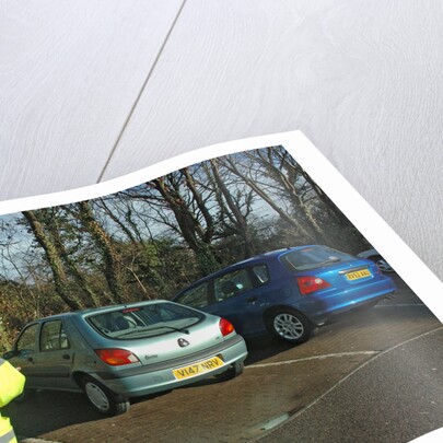 Car Park attendant recording car registration numbers by Unknown