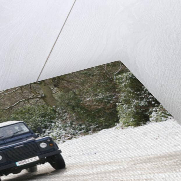 2002 Land Rover Defender driving on snowy road, 2009 by Unknown