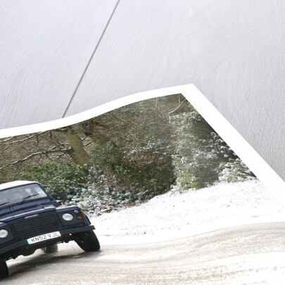 2002 Land Rover Defender driving on snowy road, 2009 by Unknown