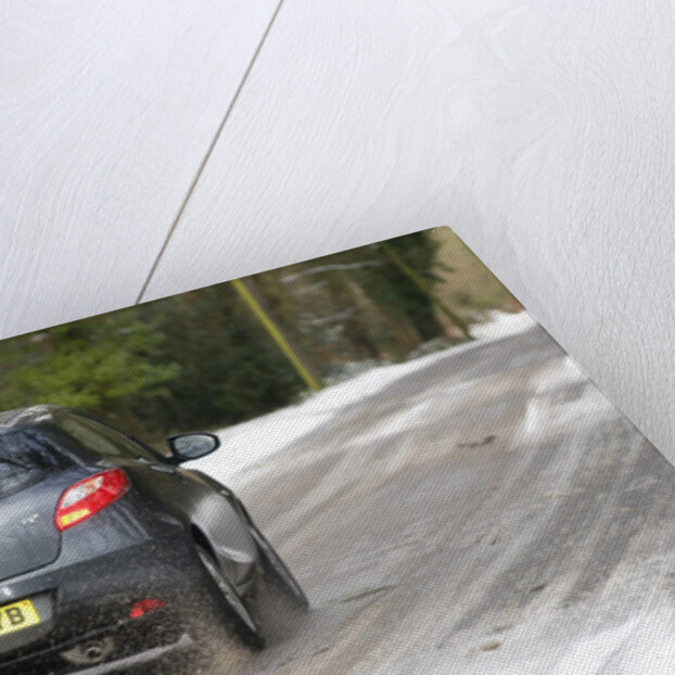 2009 Mazda 2 driving on snowy road by Unknown