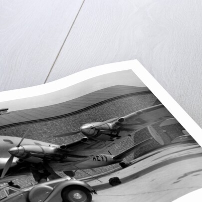 1938 Lagonda V12 4.5 litre drophead coupe with D.H. Albatross aeroplane by Unknown