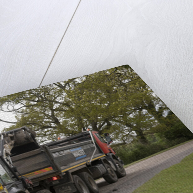 Road resurfacing work repairing potholes by Unknown