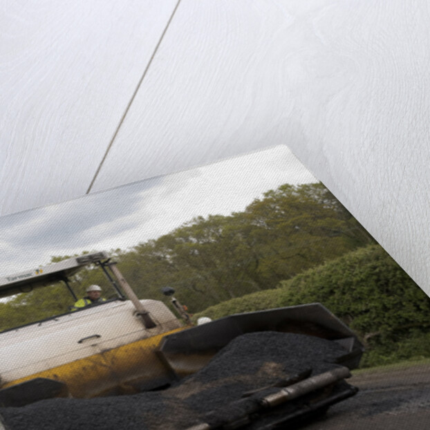 Road resurfacing work repairing potholes by Unknown