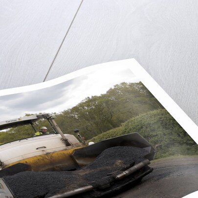 Road resurfacing work repairing potholes by Unknown