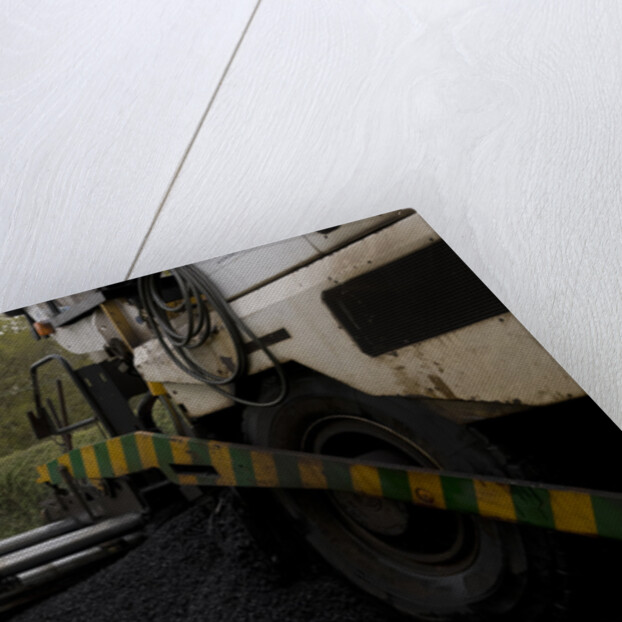 Road resurfacing work repairing potholes by Unknown