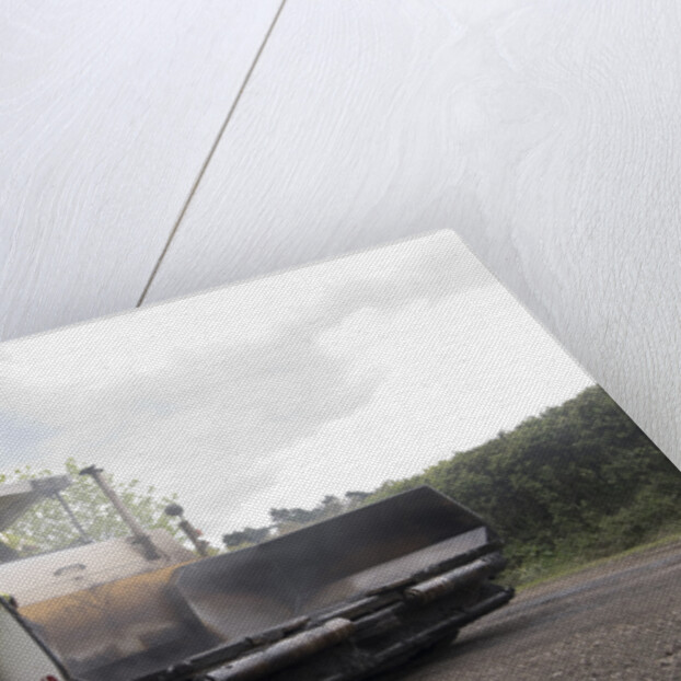 Road resurfacing work repairing potholes by Unknown