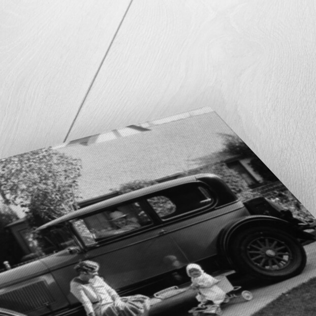 Stan Laurel at the wheel of 1927 Hupmobile with his wife Lois and daughter Lois by Unknown