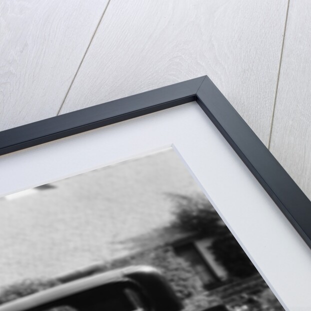 Stan Laurel at the wheel of 1927 Hupmobile with his wife Lois and daughter Lois by Unknown