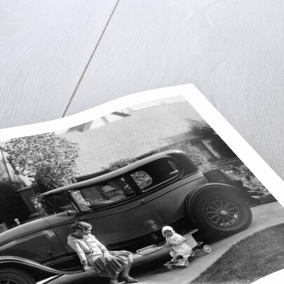 Stan Laurel at the wheel of 1927 Hupmobile with his wife Lois and daughter Lois by Unknown