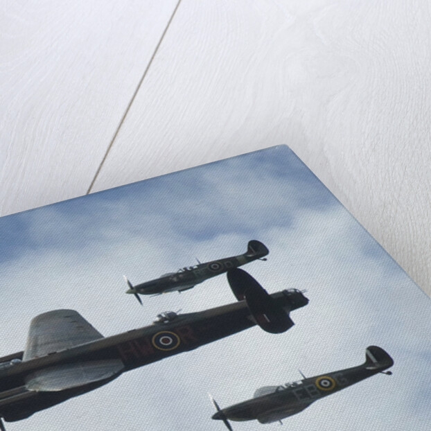 2011 Goodwood Revival Meeting, Lancaster bomber and 2 Spitfires in aerial display by Unknown