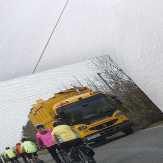 Group of cylists encounter refuse truck on country road in New Forest 2014 by Unknown