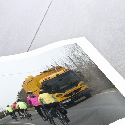 Group of cylists encounter refuse truck on country road in New Forest 2014 by Unknown