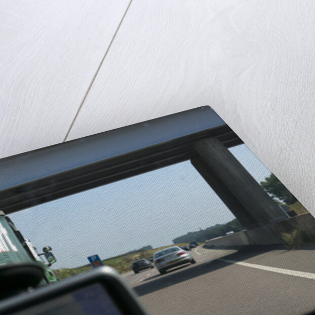 Passing Eddie Stobart truck on the A46 with satnav screen on windscreen by Anonymous