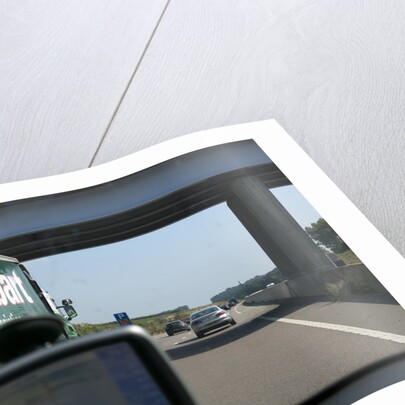 Passing Eddie Stobart truck on the A46 with satnav screen on windscreen by Anonymous