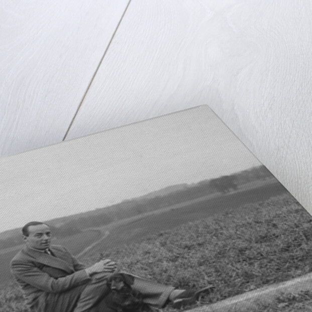 British racing driver Charles Mortimer and his pet dachshund, c1930s by Bill Brunell
