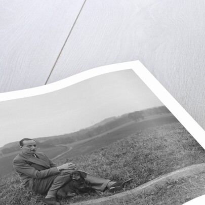 British racing driver Charles Mortimer and his pet dachshund, c1930s by Bill Brunell