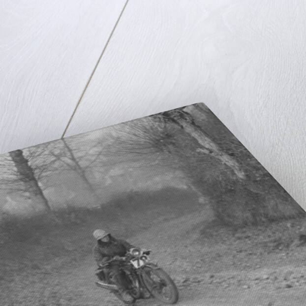 Woman riding a Royal Enfield motorcycle in the Gloucester Trial, c1930s by Bill Brunell