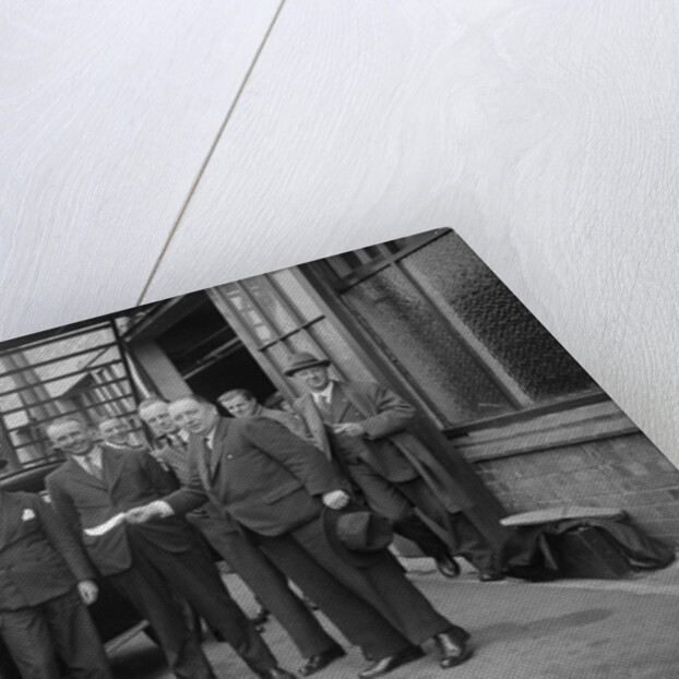 Group of men with a Triumph Super Seven, c1930(?) by Bill Brunell