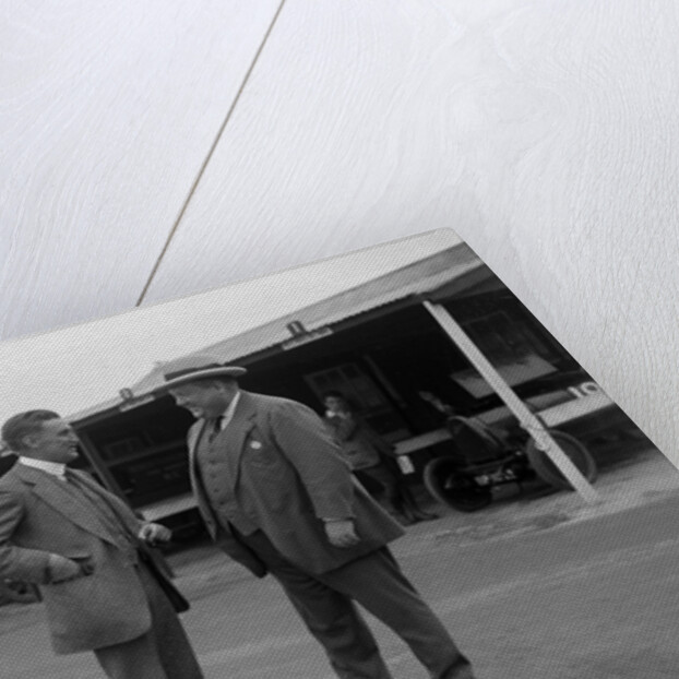 Two men chatting at Brooklands motor racing circuit, Surrey, 1920s by Bill Brunell