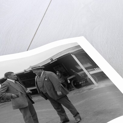 Two men chatting at Brooklands motor racing circuit, Surrey, 1920s by Bill Brunell