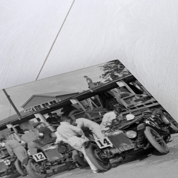 Triumph and Riley cars in the pits at the RAC TT Race, Ards Circuit, Belfast, 1929 by Bill Brunell